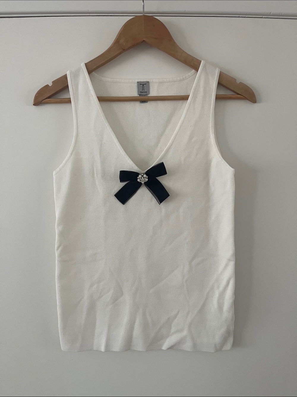Tristan White Sleeveless V-Neck Top with Black Bow Accent